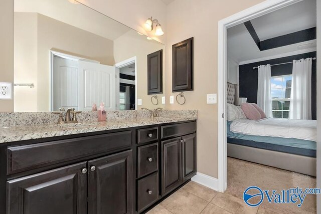 bathroom featuring tile patterned flooring and double vanity