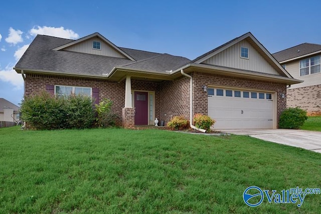 view of front of house featuring a garage and a front lawn