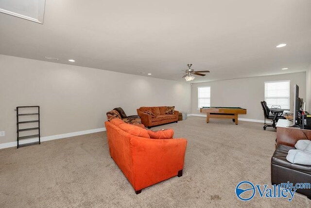 carpeted living room with pool table and ceiling fan