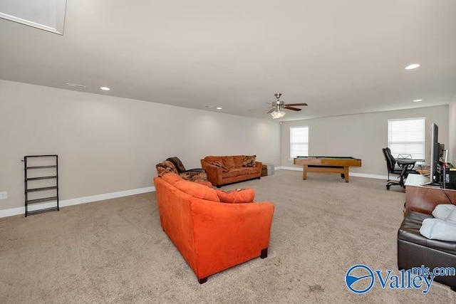 living room featuring a healthy amount of sunlight, light colored carpet, ceiling fan, and billiards