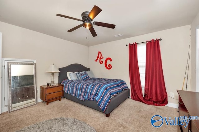 carpeted bedroom featuring ceiling fan