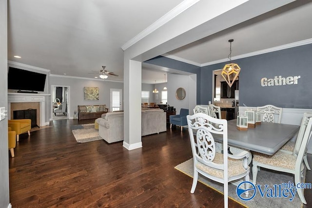 dining room featuring ornamental molding, ceiling fan, and hardwood / wood-style floors