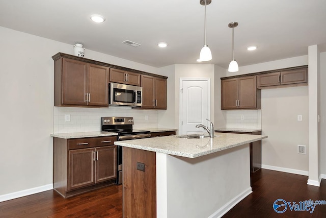 104 Summer Pointe Ln, Madison, AL 35757 - kitchen with stainless steel appliances, a sink, decorative backsplash, dark wood finished floors, and recessed lighting