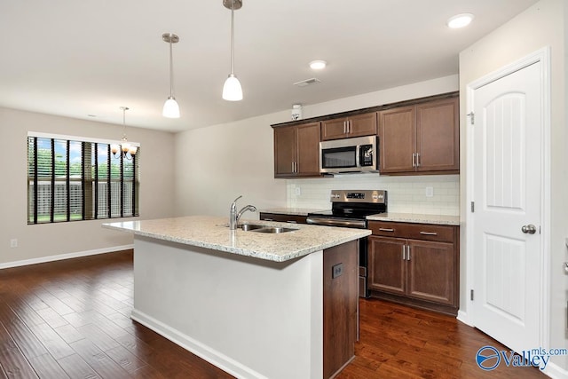104 Summer Pointe Ln, Madison, AL 35757 - kitchen featuring appliances with stainless steel finishes, a sink, dark wood finished floors, backsplash, and baseboards