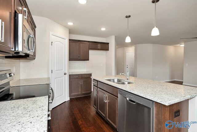 104 Summer Pointe Ln, Madison, AL 35757 - kitchen featuring appliances with stainless steel finishes, a sink, dark wood-style floors, a kitchen island with sink, and tasteful backsplash