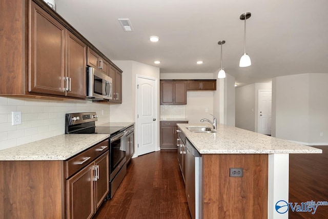 104 Summer Pointe Ln, Madison, AL 35757 - kitchen with stainless steel appliances, a sink, dark wood-type flooring, tasteful backsplash, and hanging light fixtures