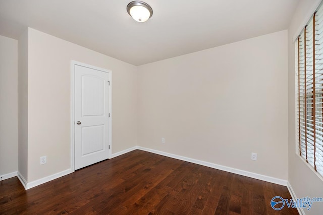 104 Summer Pointe Ln, Madison, AL 35757 - unfurnished bedroom with dark wood-style flooring and baseboards