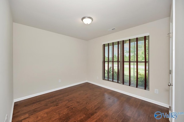 104 Summer Pointe Ln, Madison, AL 35757 - empty room with dark wood-style flooring and baseboards