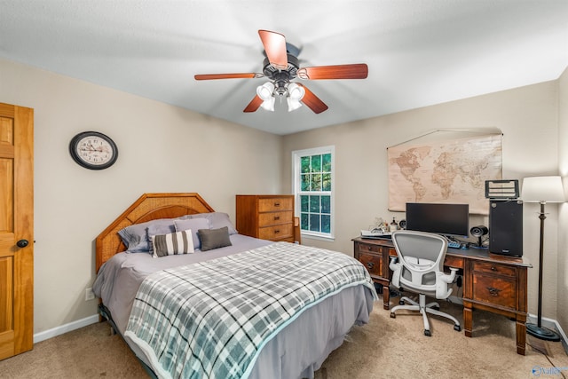 bedroom featuring ceiling fan and light colored carpet