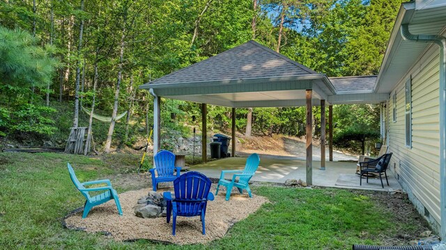 view of yard with a patio area and an outdoor fire pit