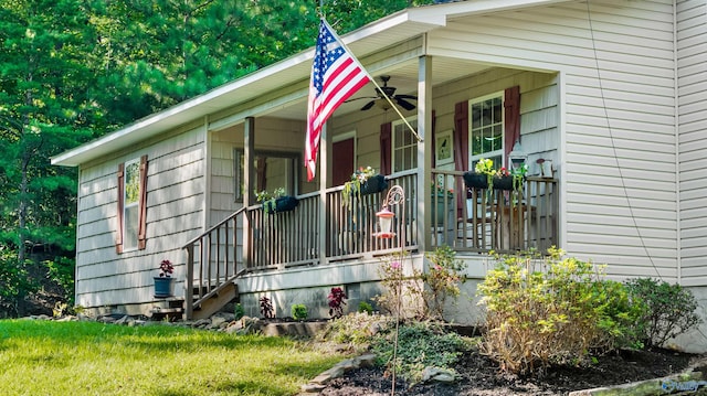 view of exterior entry featuring covered porch