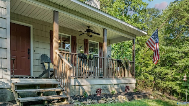 entrance to property featuring a porch and ceiling fan