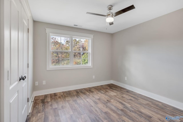 unfurnished room featuring ceiling fan and hardwood / wood-style flooring