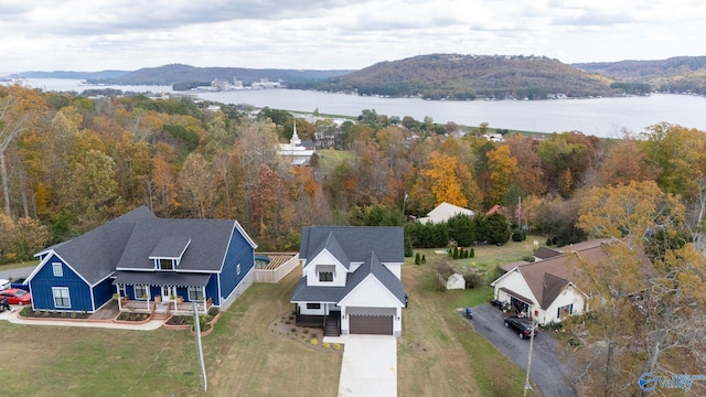 birds eye view of property featuring a water and mountain view