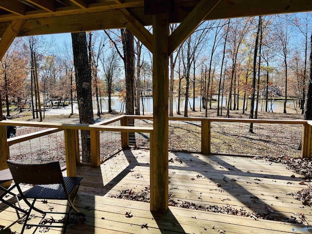 wooden deck featuring a water view