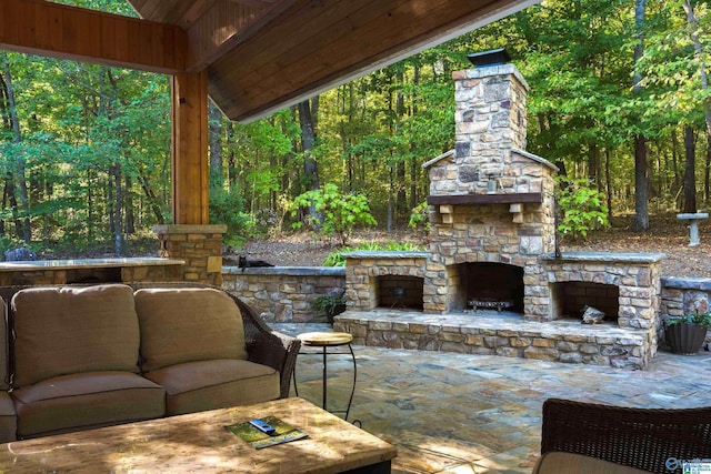 view of patio / terrace with an outdoor stone fireplace