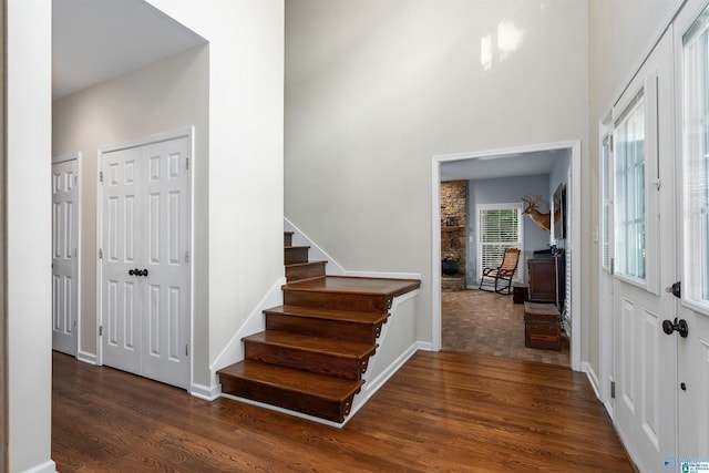 entrance foyer with dark hardwood / wood-style floors