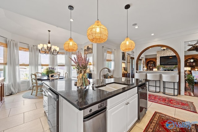 3127 Haddonstone Dr SE, Owens Cross Roads, AL 35763 - kitchen featuring a sink, stainless steel dishwasher, white cabinetry, a chandelier, and light tile patterned floors