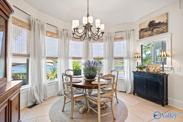 3127 Haddonstone Dr SE, Owens Cross Roads, AL 35763 - dining space featuring light tile patterned floors, a chandelier, and baseboards