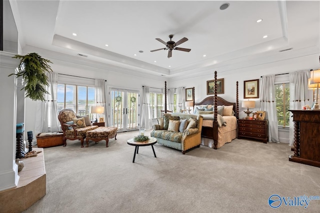 3127 Haddonstone Dr SE, Owens Cross Roads, AL 35763 - bedroom featuring a raised ceiling, light carpet, multiple windows, and access to outside