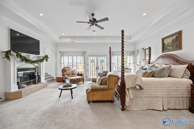 3127 Haddonstone Dr SE, Owens Cross Roads, AL 35763 - bedroom with access to exterior, a raised ceiling, a fireplace, carpet floors, and ornamental molding