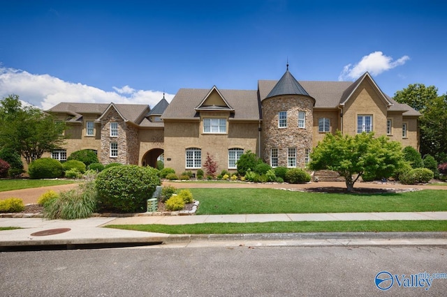 3127 Haddonstone Dr SE, Owens Cross Roads, AL 35763 - view of front facade featuring a front lawn and stone siding