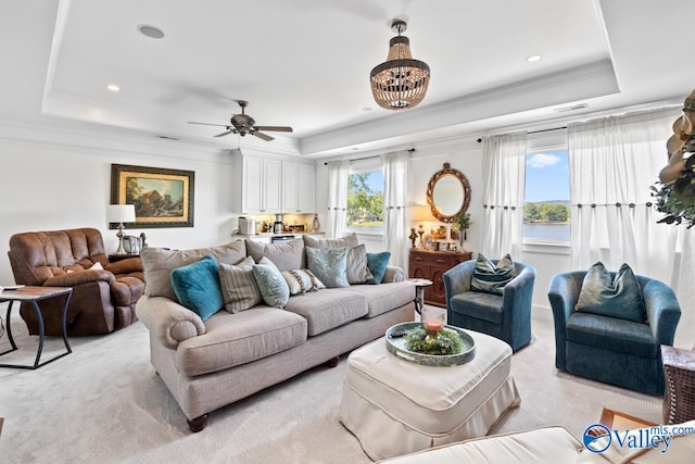 3127 Haddonstone Dr SE, Owens Cross Roads, AL 35763 - living area with a tray ceiling, light carpet, ornamental molding, a ceiling fan, and recessed lighting