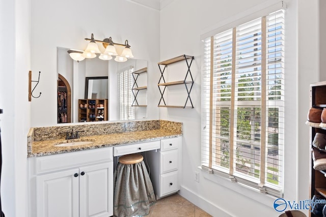 3127 Haddonstone Dr SE, Owens Cross Roads, AL 35763 - bathroom featuring plenty of natural light, vanity, baseboards, and tile patterned flooring
