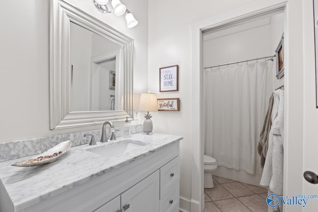 3127 Haddonstone Dr SE, Owens Cross Roads, AL 35763 - full bathroom featuring vanity, toilet, tile patterned floors, and a shower with curtain