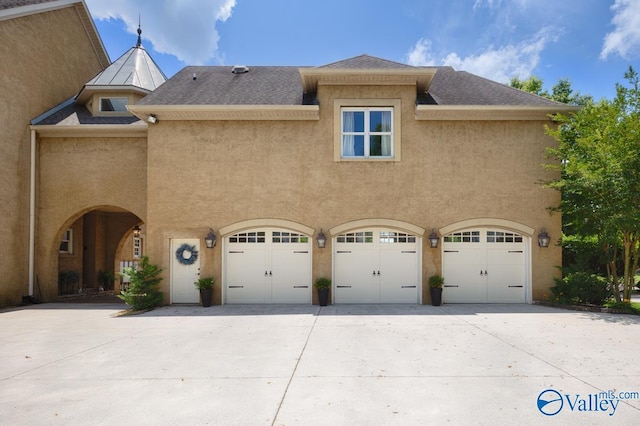 3127 Haddonstone Dr SE, Owens Cross Roads, AL 35763 - view of home's exterior featuring an attached garage, concrete driveway, and stucco siding