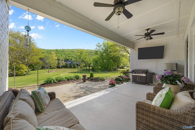 view of patio featuring an outdoor hangout area and ceiling fan