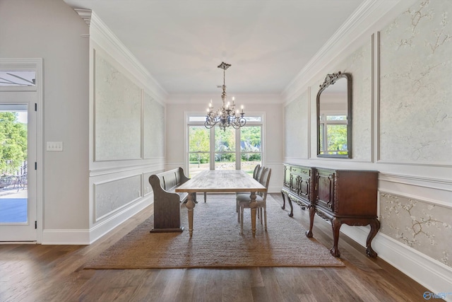 dining area featuring crown molding, a chandelier, a wealth of natural light, and wood finished floors