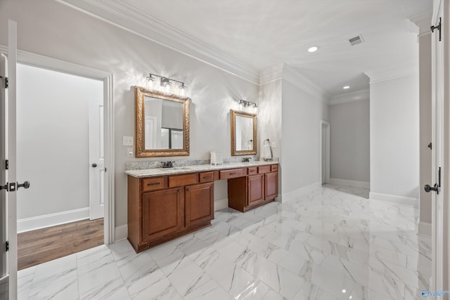 full bath with double vanity, crown molding, a sink, baseboards, and recessed lighting