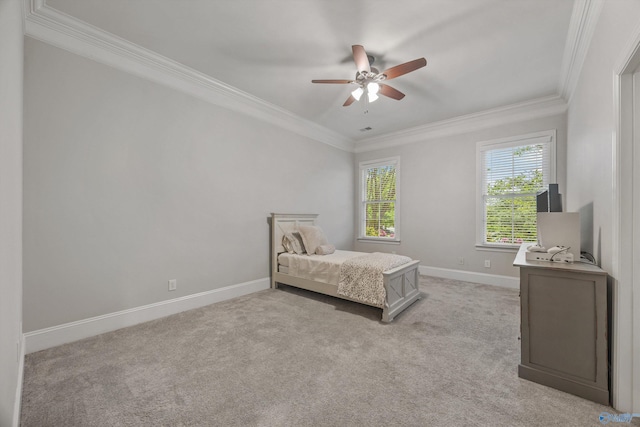 bedroom featuring baseboards, light colored carpet, ornamental molding, and ceiling fan