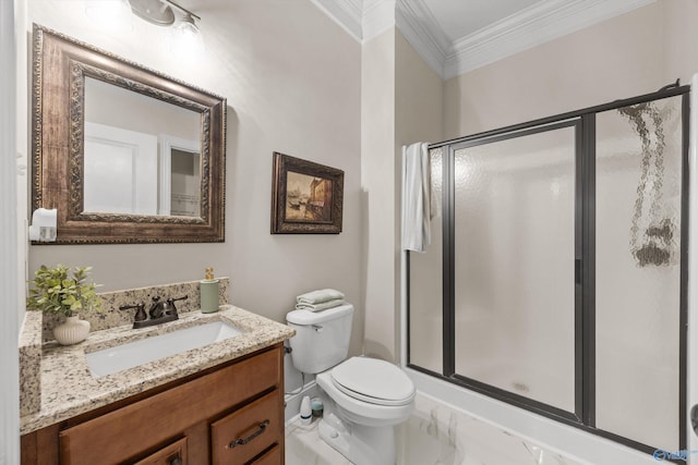 full bathroom with vanity, ornamental molding, a shower stall, and toilet