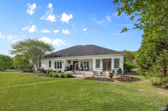 back of house with a patio, ceiling fan, a lawn, and stucco siding