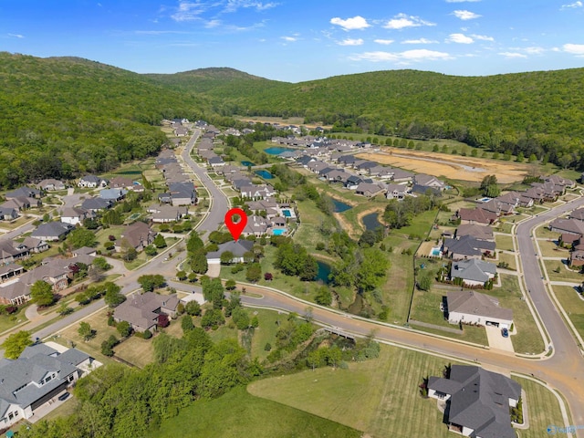 drone / aerial view with a view of trees, a residential view, and a mountain view