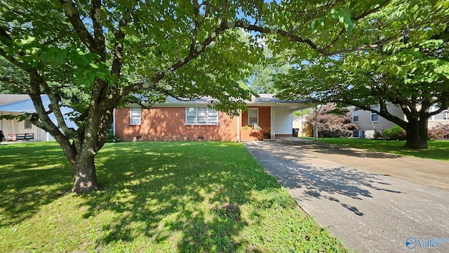 325 Crestview St, Athens, AL 35611 - single story home with crawl space, concrete driveway, brick siding, a front yard, and a carport