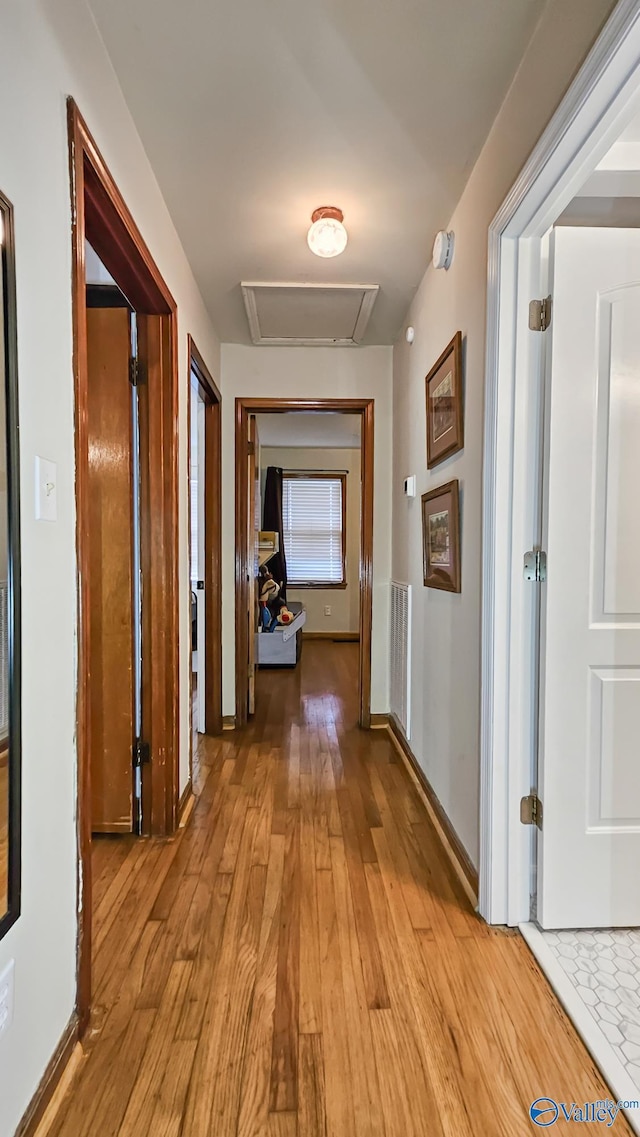 325 Crestview St, Athens, AL 35611 - corridor with light wood-style flooring and attic access