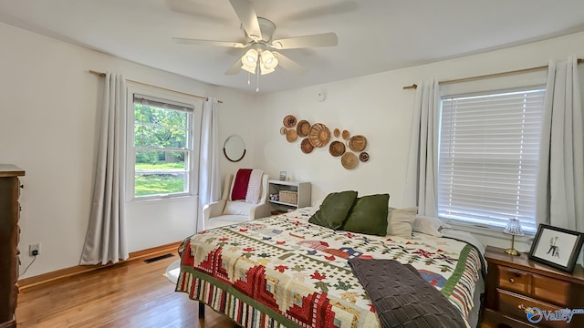 325 Crestview St, Athens, AL 35611 - bedroom with wood finished floors and ceiling fan