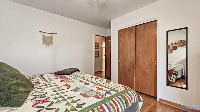 325 Crestview St, Athens, AL 35611 - bedroom with wood finished floors, a closet, and ceiling fan