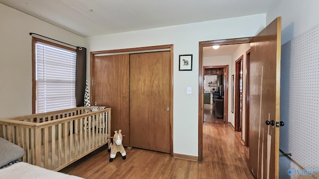 325 Crestview St, Athens, AL 35611 - bedroom featuring wood finished floors and a closet