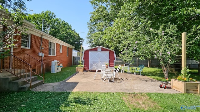 325 Crestview St, Athens, AL 35611 - fenced backyard with a storage shed and a patio