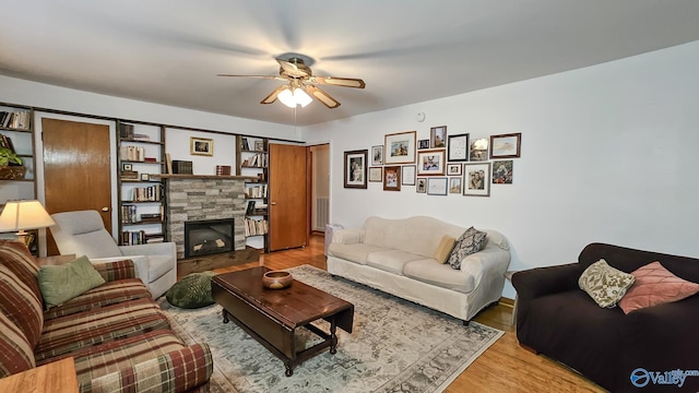 325 Crestview St, Athens, AL 35611 - living area with ceiling fan, wood finished floors, and a fireplace