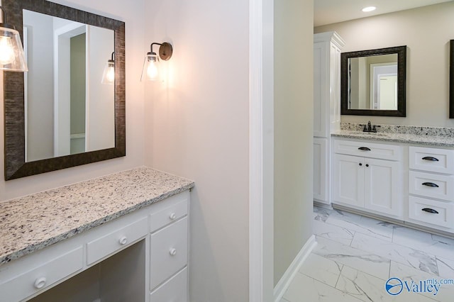 bathroom featuring recessed lighting, marble finish floor, vanity, and baseboards