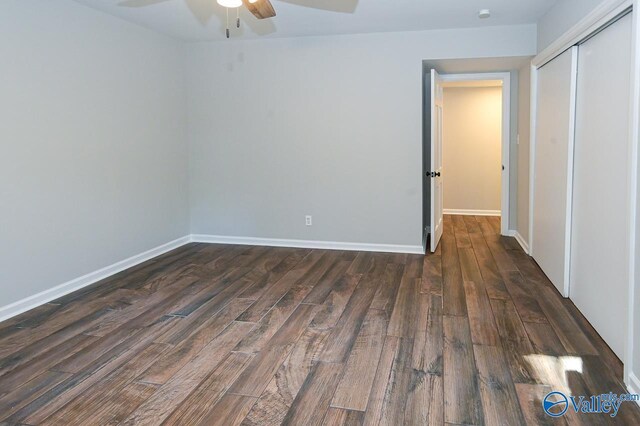 unfurnished bedroom featuring ceiling fan, hardwood / wood-style flooring, and a closet