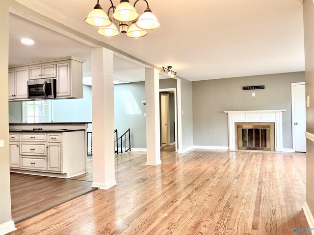 stairs featuring a skylight and hardwood / wood-style floors