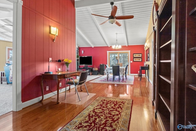 office featuring vaulted ceiling with beams, ceiling fan with notable chandelier, and light wood-type flooring