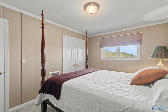 carpeted bedroom featuring crown molding