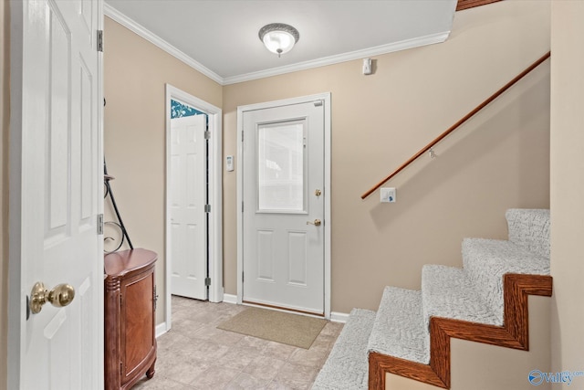 foyer featuring crown molding